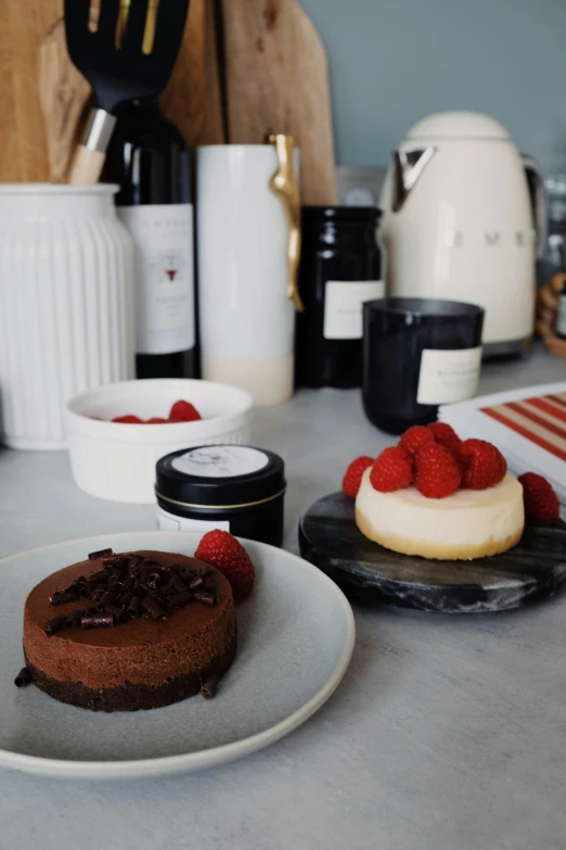 a close up of a plate of food on a counter, inspired by Richmond Barthé, unsplash, romanticism, fully chocolate, raspberry, home display, full product shot