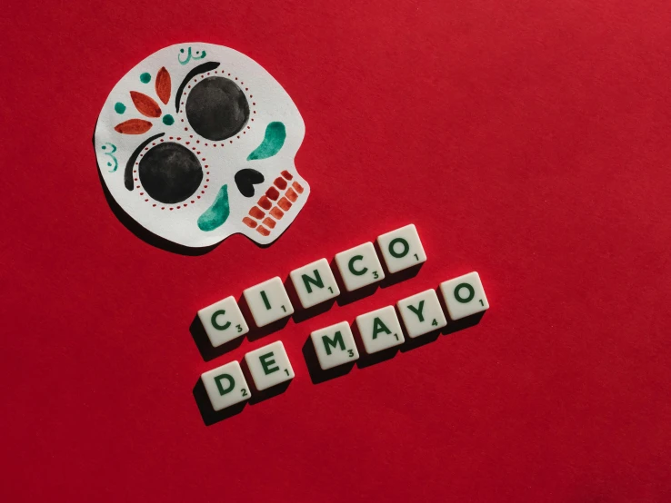 a white sugar skull sitting on top of a red surface, pexels contest winner, funny jumbled letters, mayo, background image, costume