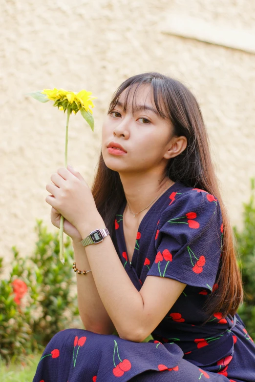 a woman kneeling down with a flower in her hand, inspired by Ruth Jên, unsplash, wearing a watch, young asian woman, 🤤 girl portrait, teenage girl