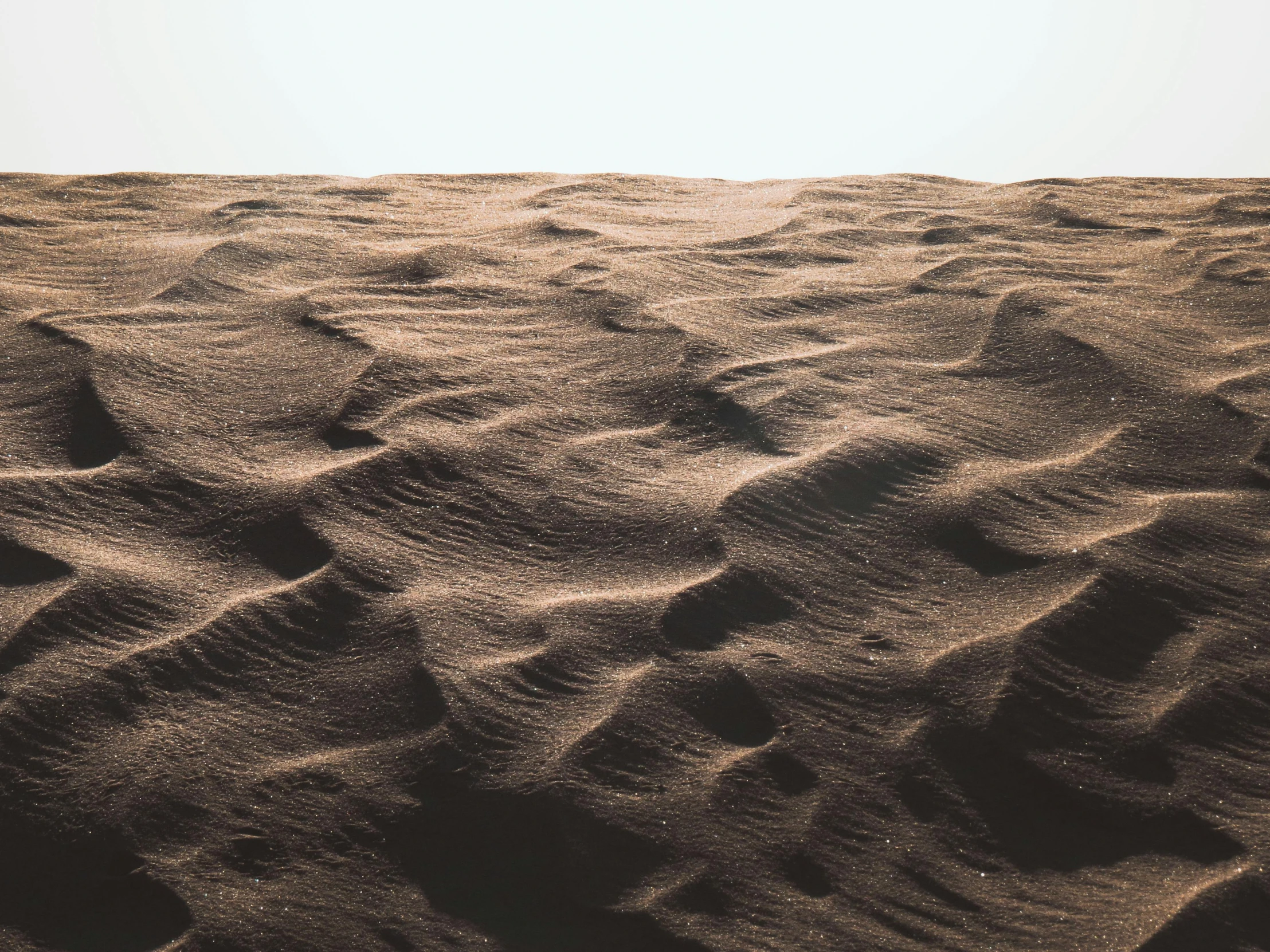 a person riding a surfboard on top of a sandy beach, an album cover, by Daniel Lieske, pexels contest winner, visual art, barren desert landscape, quixel megascans, high detail photo of a deserted, lunar soil