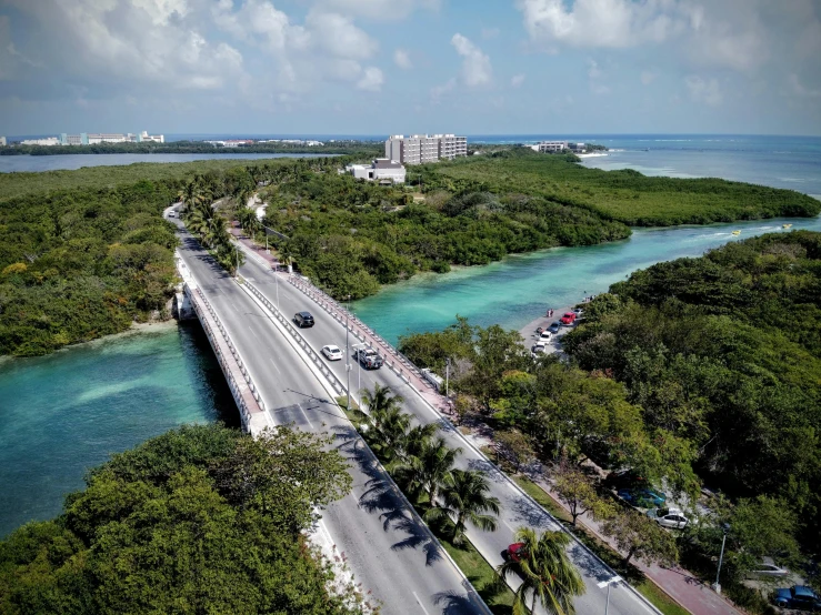 an aerial view of a bridge over a body of water, by Carey Morris, pexels contest winner, photorealism, mayan, vice city, road trip, thumbnail