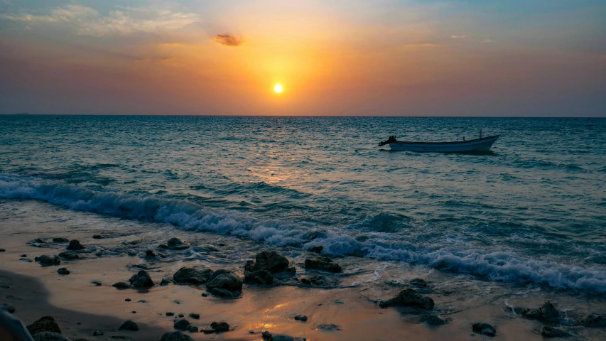 a boat sitting on top of a beach next to the ocean, a picture, during a sunset, varadero beach, unsplash photo contest winner, somalia