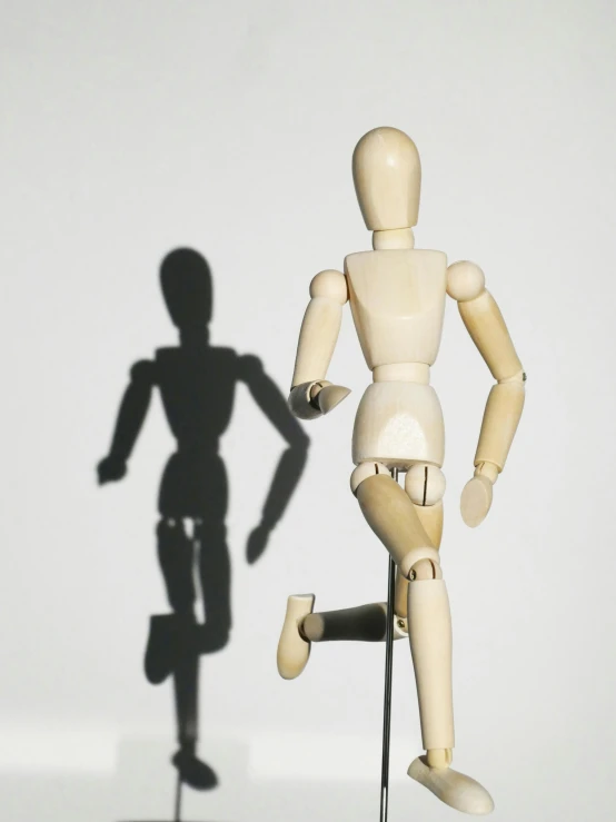 a wooden mannequin standing next to a mannequin, pexels contest winner, dynamic active running pose, 15081959 21121991 01012000 4k, robot shadow, instagram post