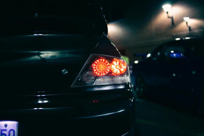 a close up of the tail lights of a car, inspired by An Gyeon, unsplash, modified, taken in the late 2000s, instagram photo, beautiful rim lighting