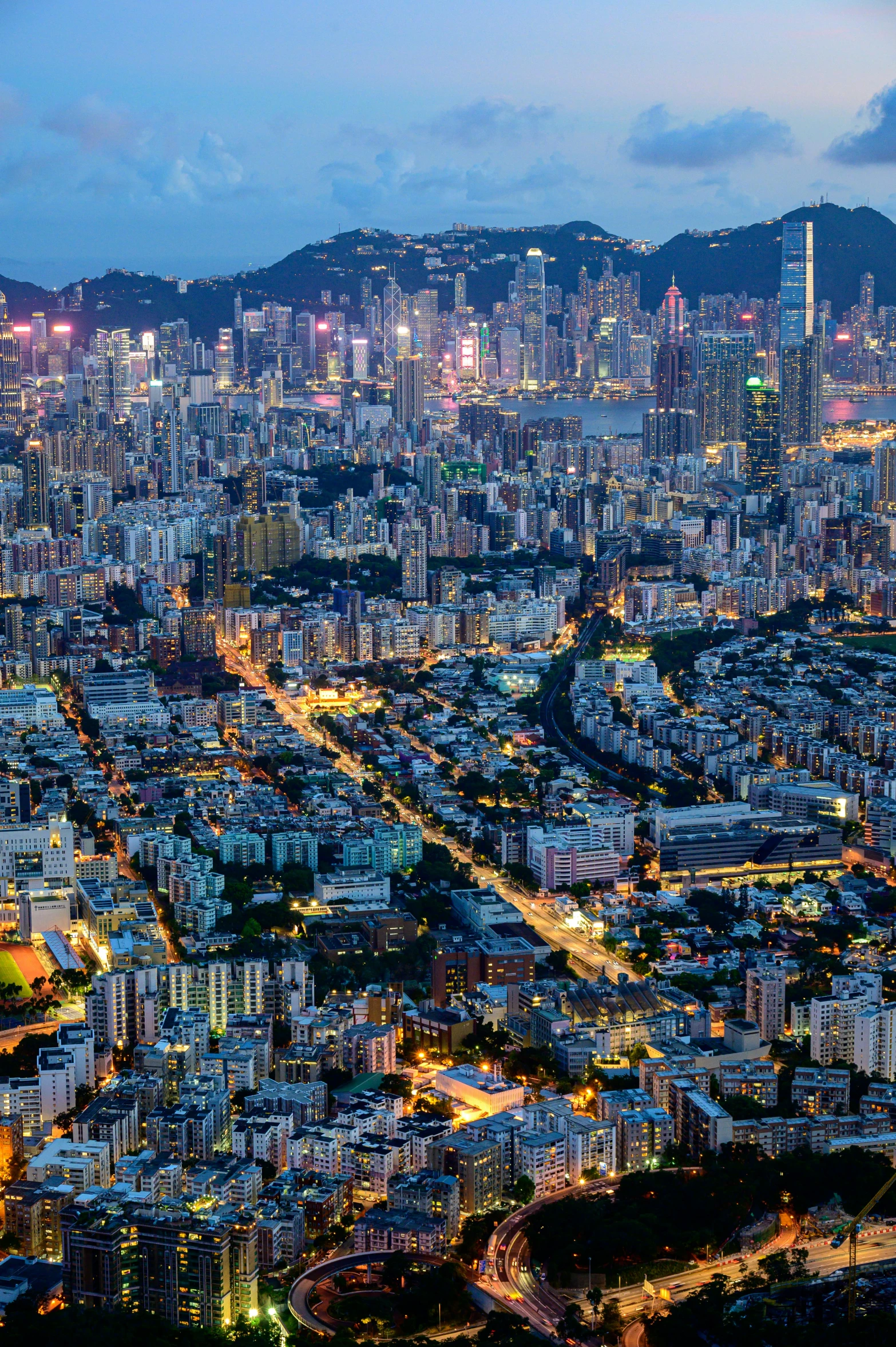 an aerial view of a city at night, pexels contest winner, a still of kowloon, twilight skyline, shenzhen, 8 k detail