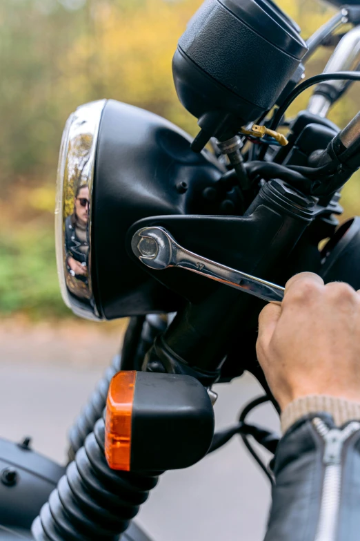 a close up of a person on a motorcycle, by David Simpson, unsplash, levers, where a large, customers, panels