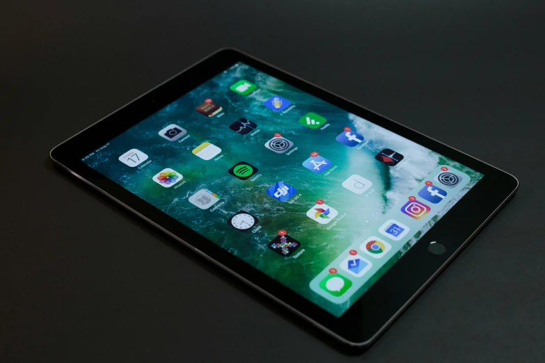 a tablet computer sitting on top of a table, by Carey Morris, pexels, square, panel of black, apple, hyperdetailed