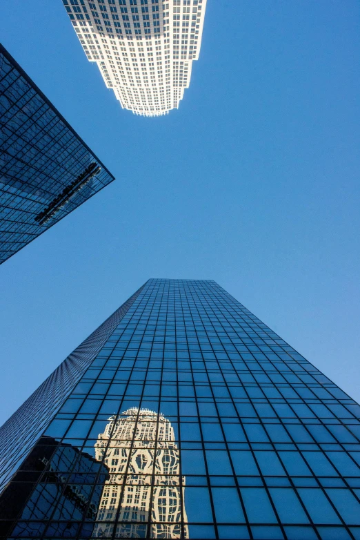 some very tall buildings in a big city, by David Donaldson, minimalism, tx, commercial photograph, award - winning, glass and lights