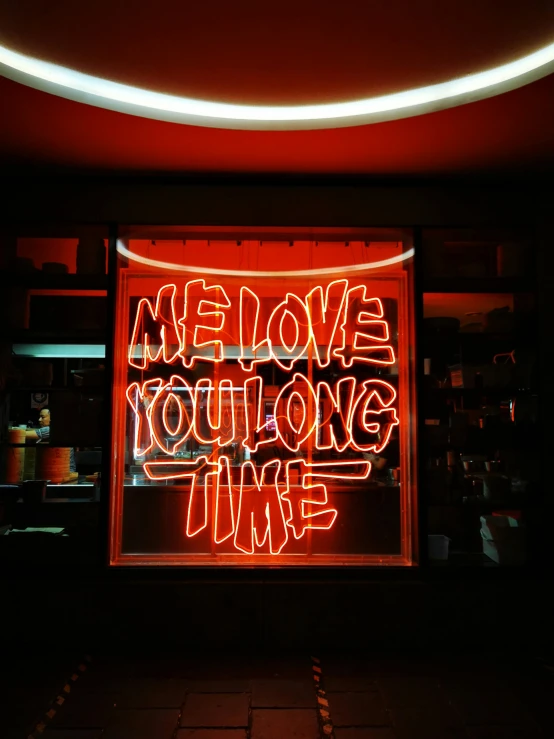 a neon sign hanging from the side of a building, profile image, me and you, slowtime, love theme