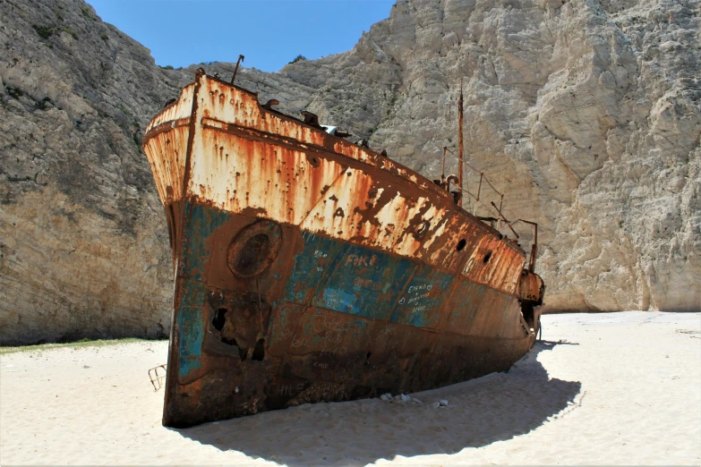 a rusted ship sitting on top of a sandy beach, pexels contest winner, with full descriptions, preserved historical, europa, video still