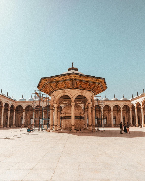 a group of people walking around a courtyard, a colorized photo, unsplash contest winner, arabesque, dome of wonders, 🚿🗝📝, from egypt, sunny day time