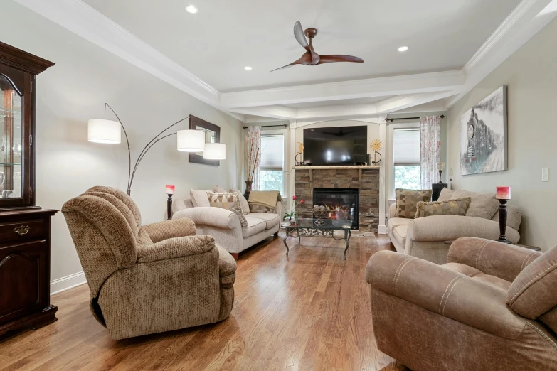 a living room filled with furniture and a fire place, a picture, listing image