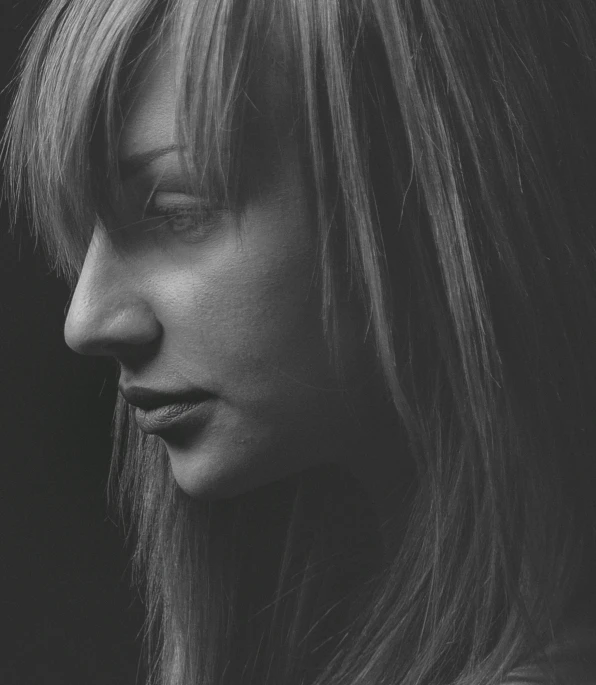 a black and white photo of a woman with long hair, by Neil Blevins, pexels contest winner, hyperrealism, portrait of max caulfield, side light, olivia wilde, side profile cenetered portrait