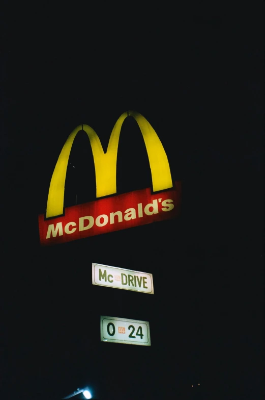 a mcdonald's sign is lit up at night, an album cover, pexels, renaissance, photo 1998, sports photo, todd hido, 2 5 6 x 2 5 6 pixels