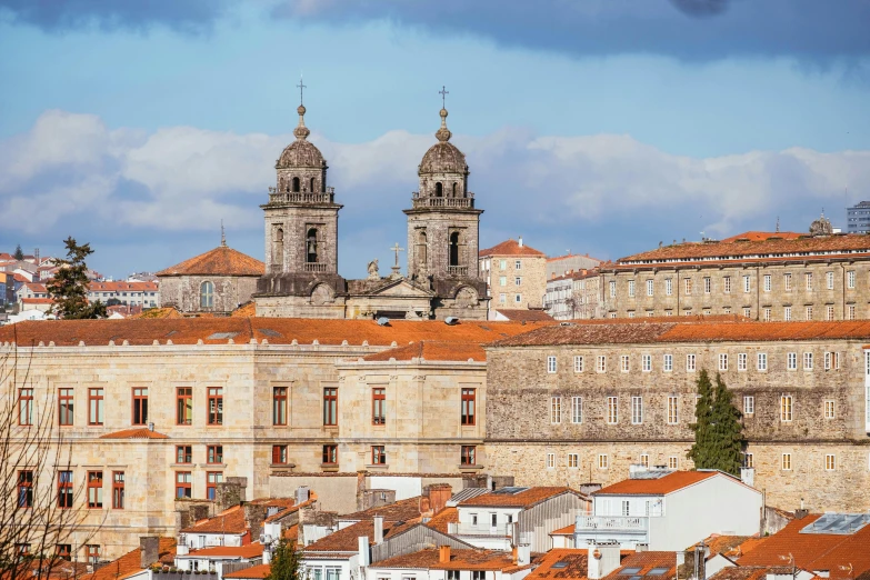 a group of buildings that are next to each other, by Juan Giménez, pexels contest winner, baroque, orange roof, cathedral in the background, square, high resolution image