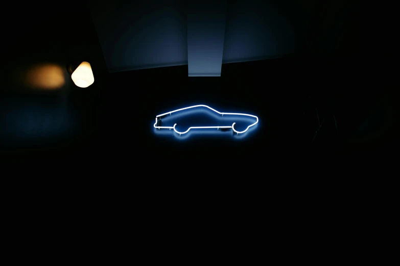 a neon sign of a car in the dark, by Tom Bonson, minimalism, neon blue, vantablack wall, ((blue)), muscle cars