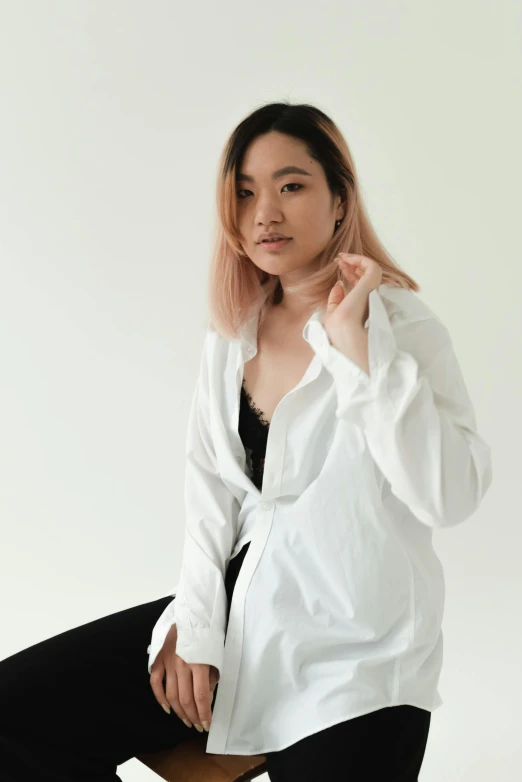 a woman in a white shirt and black pants, inspired by Feng Zhu, trending on unsplash, renaissance, sleepwear, portrait image, pastel clothing, asian human