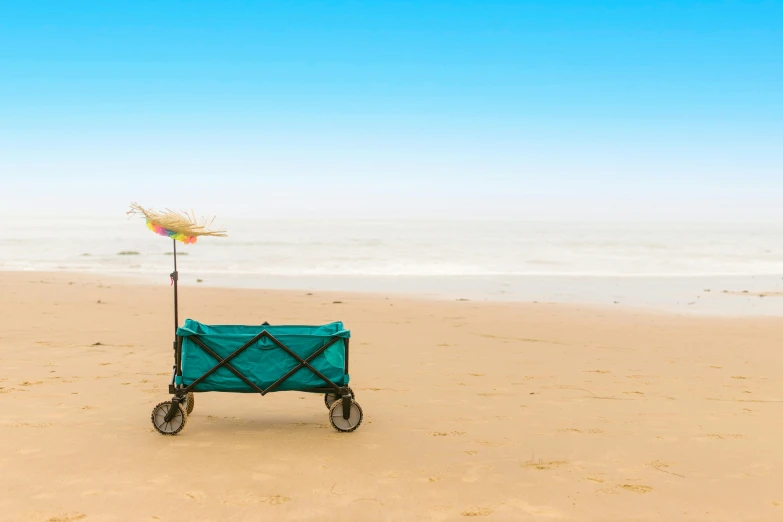 a green wagon sitting on top of a sandy beach, pixabay contest winner, minimalism, northern france, turquoise ocean, profile image, hollister ranch