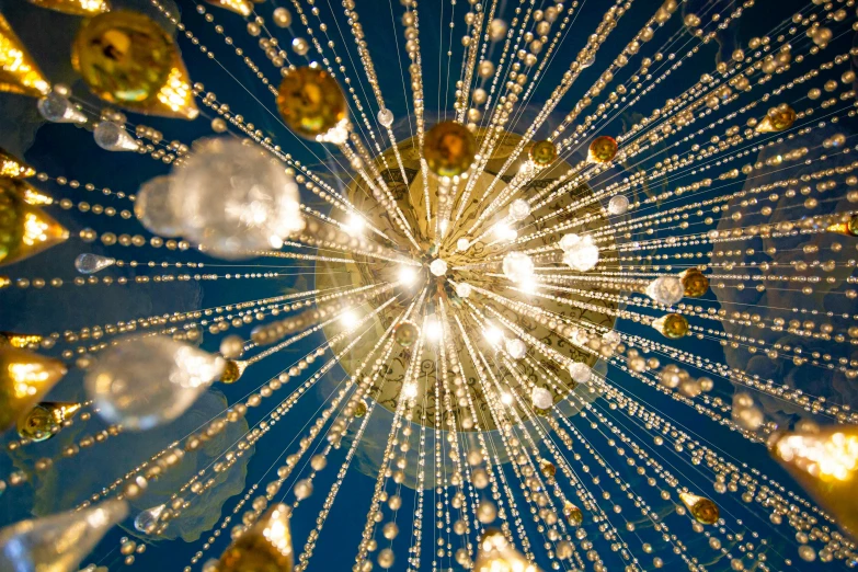 a bunch of lights that are in the air, an album cover, by Jan Rustem, pexels, light and space, blue and white and gold, swarovski crystals, fulldome, gold decoration