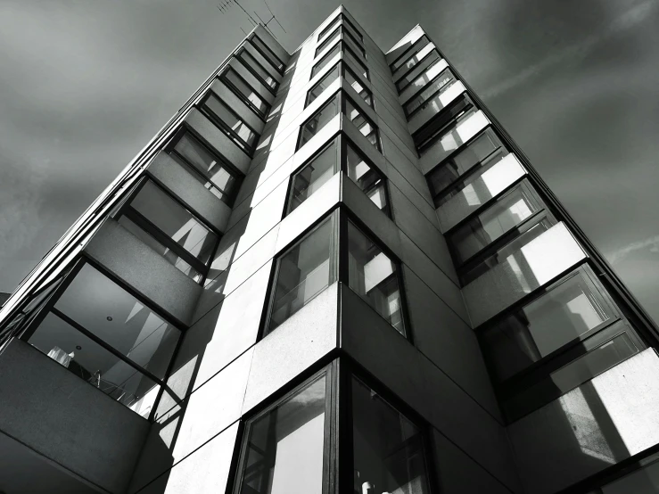 a black and white photo of a tall building, by Bauhaus, unsplash, bauhaus, wideangle, low angle!!!!, black & white, monochrome 3 d model