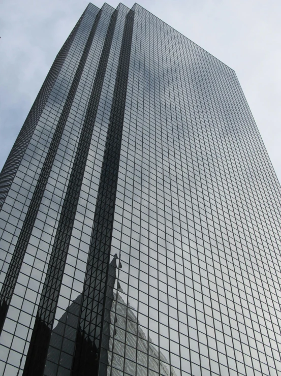 a very tall building with a lot of windows, that is 1300 feet tall, konica minolta, minneapolis, ((monolith))