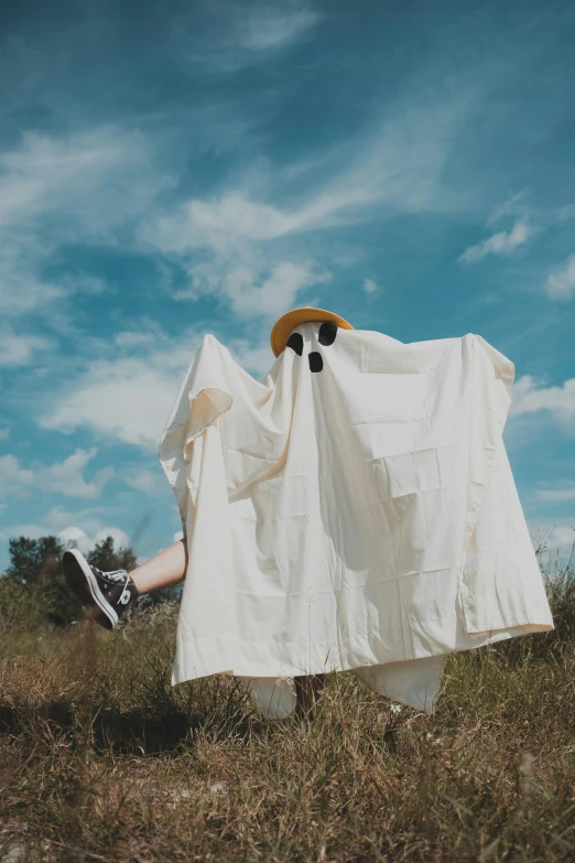 a person that is standing in the grass, white cloth, fancy dress, hypebeast, ghost giant above the horizon