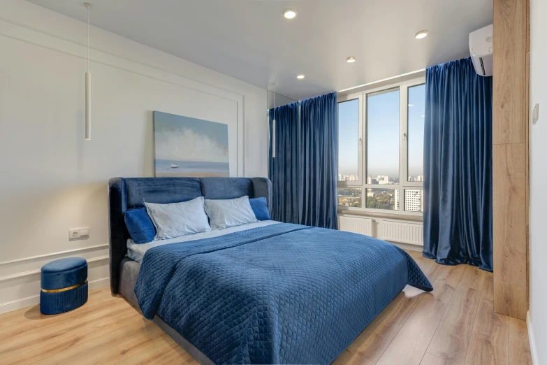 a bed sitting in a bedroom next to a window, blue theme, 000 — википедия, city view, real estate photography