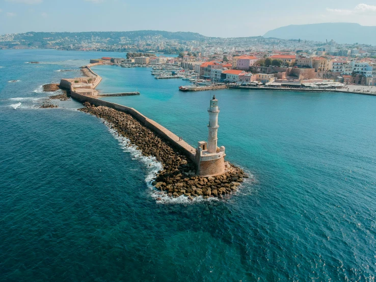 a lighthouse in the middle of a body of water, mediterranean city, flatlay, documentary photo