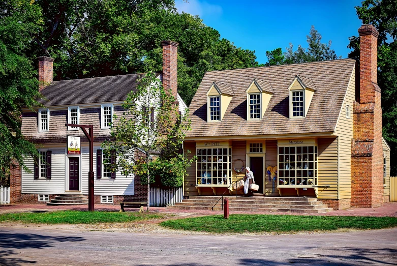 a couple of houses sitting on the side of a road, a digital rendering, by Carey Morris, pexels contest winner, historical reenactment, storefronts, colonial, to