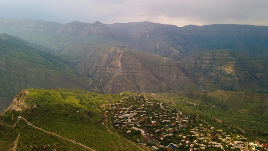 an aerial view of a small town in the mountains, a picture, dau-al-set, yggrdasil, conde nast traveler photo