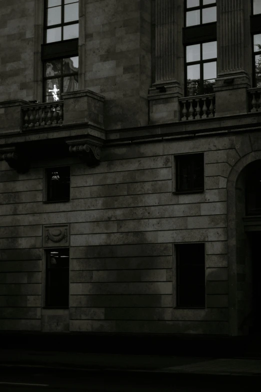a black and white photo of a building, by Pablo Rey, neoclassicism, dark aesthetics, early evening, black windows, scaring