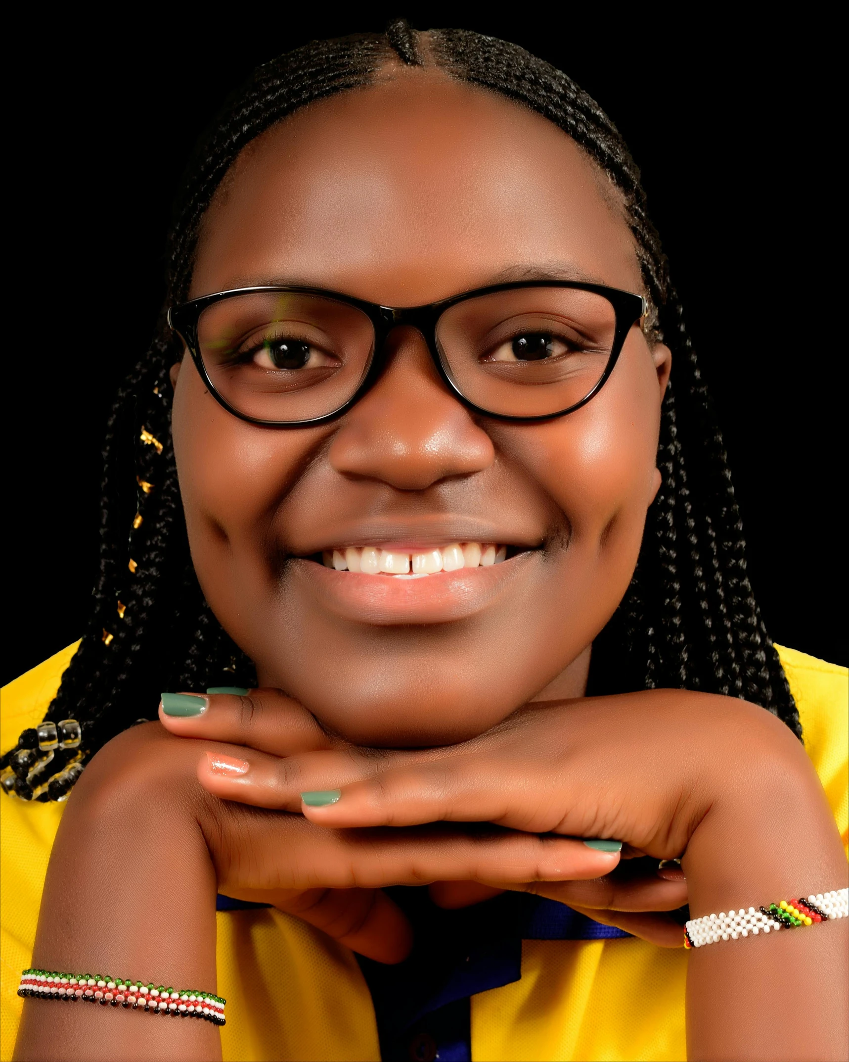 a close up of a person wearing glasses, by Chinwe Chukwuogo-Roy, pexels contest winner, elegant yellow skin, smiling sweetly, lgbtq, official government photo