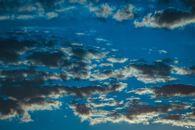 a plane flying through a cloudy blue sky, inspired by Elsa Bleda, unsplash, late summer evening, 1 5 9 5, ceremonial clouds, new mexico