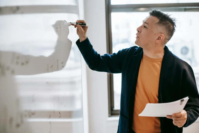 a man writing on a white board in an office, a hyperrealistic painting, pexels contest winner, jin shan and ross tran, plain background, background image, profile image