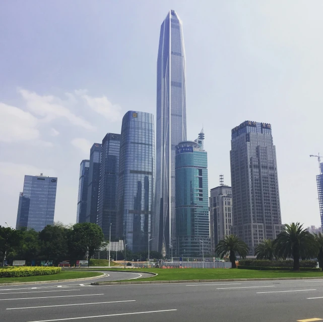 a view of a city with a lot of tall buildings, inspired by Cheng Jiasui, pexels contest winner, avatar image, sunny day time, shenzhen, ground level shot