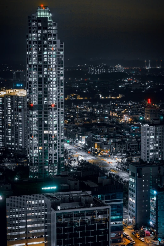 an aerial view of a city at night, pexels contest winner, hyperrealism, tall towers, stacked image, gif, japanese city
