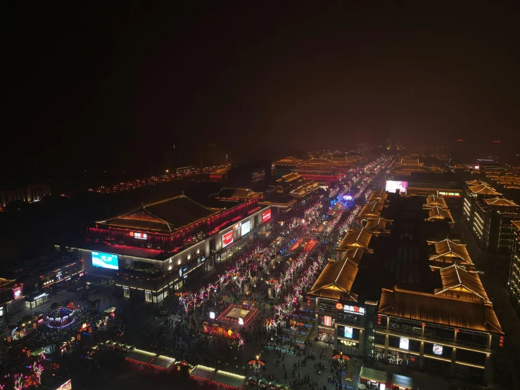 an aerial view of a city at night, pexels contest winner, happening, tang dynasty palace, festival. scenic view at night, thumbnail, square