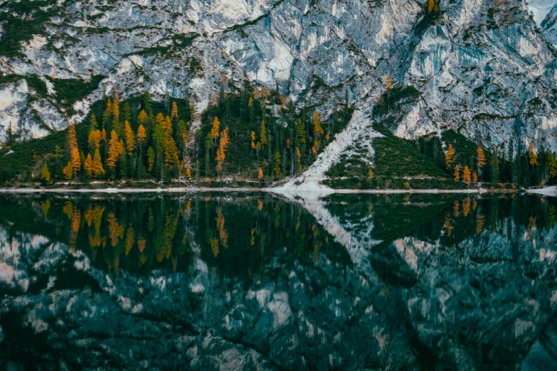 a body of water with a mountain in the background, by Matthias Weischer, pexels contest winner, visual art, trees reflecting on the lake, detailed symmetry, rocky cliff, thumbnail