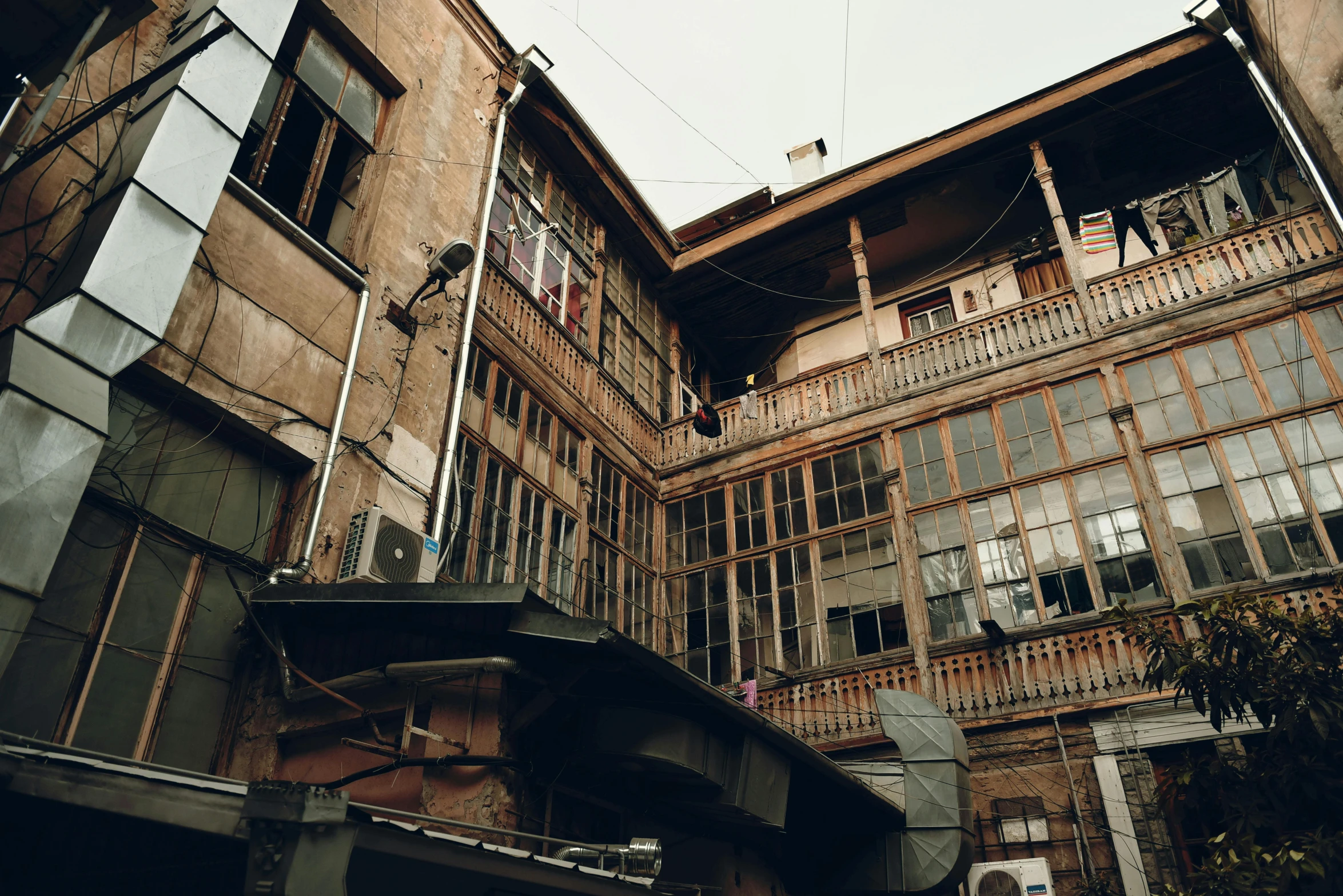 a couple of buildings that are next to each other, inspired by Elsa Bleda, pexels contest winner, renaissance, hasan piker, old house, 2 0 0 0's photo, located in hajibektash complex