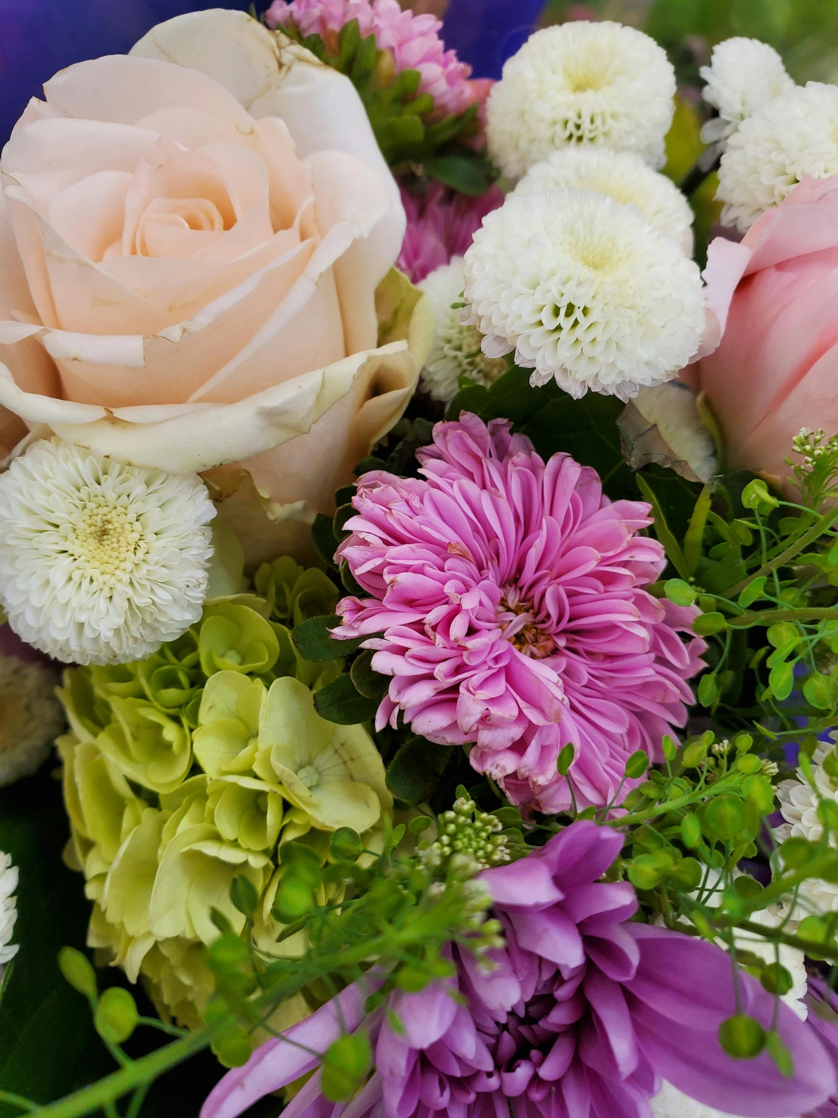 a bouquet of flowers sitting on top of a table, up-close, up close