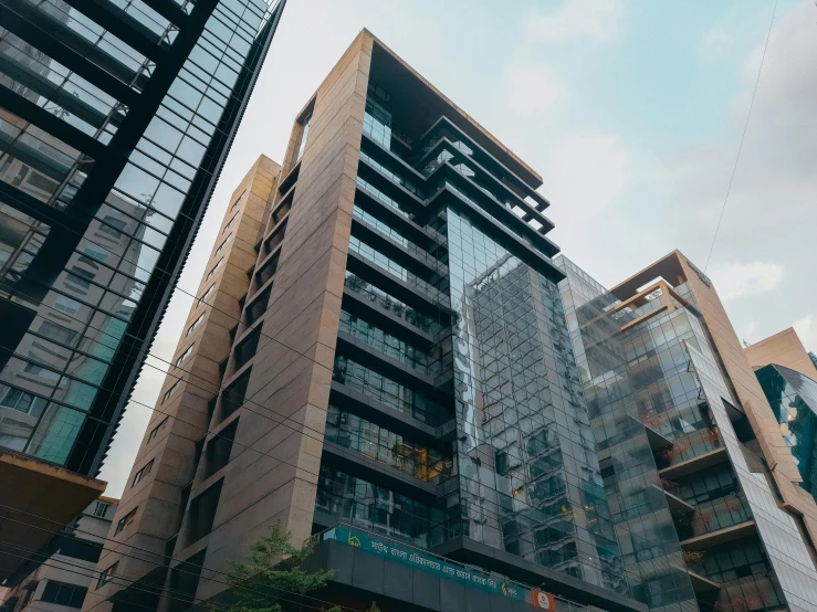 a group of tall buildings sitting next to each other, shot with hasselblade camera, brown, thumbnail, exterior shot