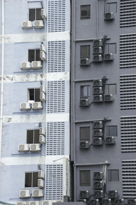 a couple of buildings that are next to each other, an album cover, pexels contest winner, air conditioner, telephoto shot, grey, singapore