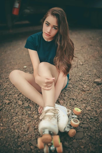 a woman sitting on the ground with a skateboard, inspired by Elsa Bleda, unsplash, renaissance, girl with brown hair, standing on rocky ground, snacks, headshot
