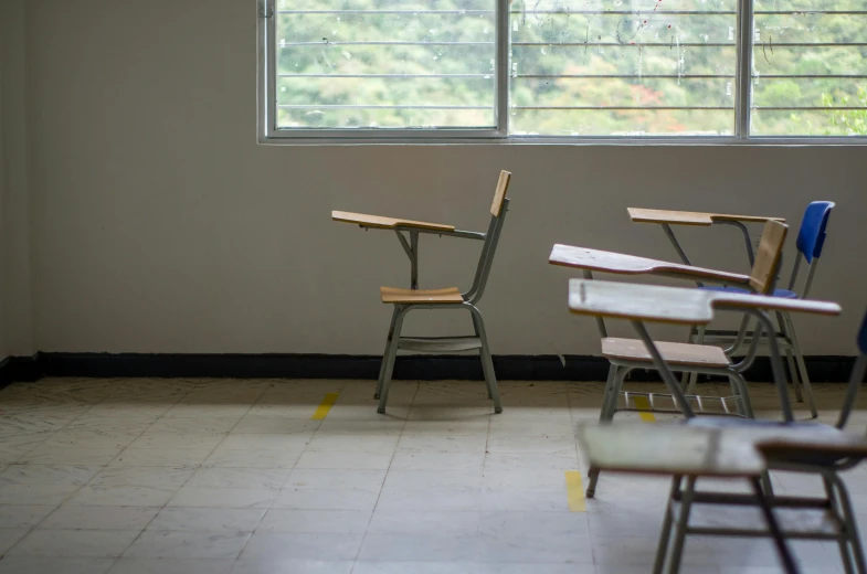 a classroom with desks and chairs in front of a window, a portrait, by Elsa Bleda, unsplash, fan favorite, single chair, isolated, background image