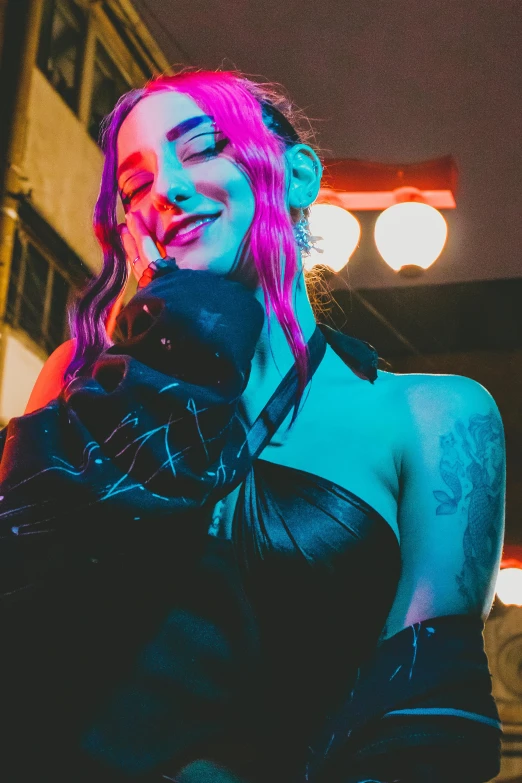 a woman with pink hair standing in front of a building, cyberpunk art, by Matt Cavotta, trending on pexels, in a leather corset, glowing hands, smiling seductively, lil peep