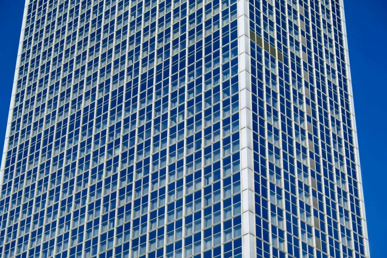 a tall building with a clock on top of it, inspired by Andreas Gursky, modern high sharpness photo, blue shutters on windows, ultra detailed photo, high details photo