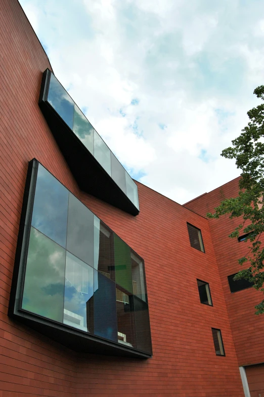 a red brick building with a lot of windows, inspired by Tadao Ando, slide show, up-close, brown, exterior