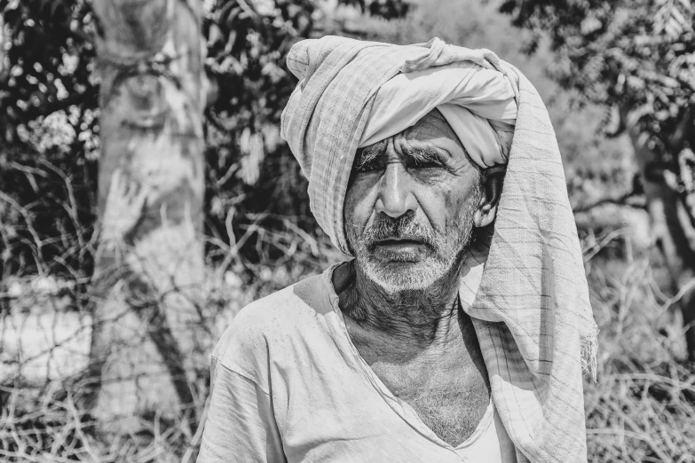 a black and white photo of a man with a turban on his head, by Rajesh Soni, pexels contest winner, samikshavad, villagers busy farming, with a sad expression, an oldman, hd wallpaper