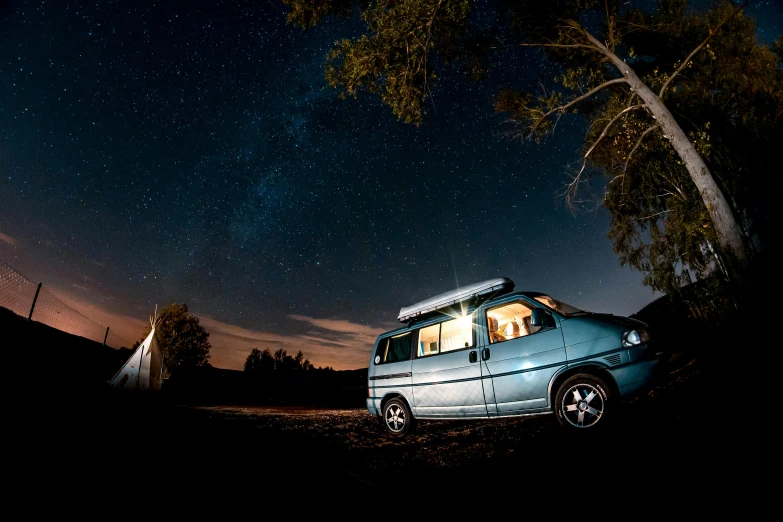 a van parked next to a tree under a night sky, a portrait, unsplash contest winner, mongolia, glamping, profile picture, vhs colour photography