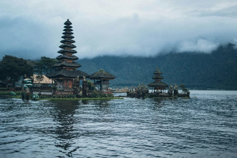 a group of pagodas sitting on top of a body of water, by Daniel Lieske, pexels contest winner, sumatraism, square, high quality image, fan favorite, underwater shrine